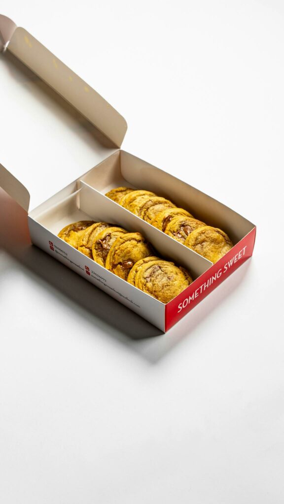 High-quality image of chocolate chip cookies neatly packed in a box with clear copyspace.